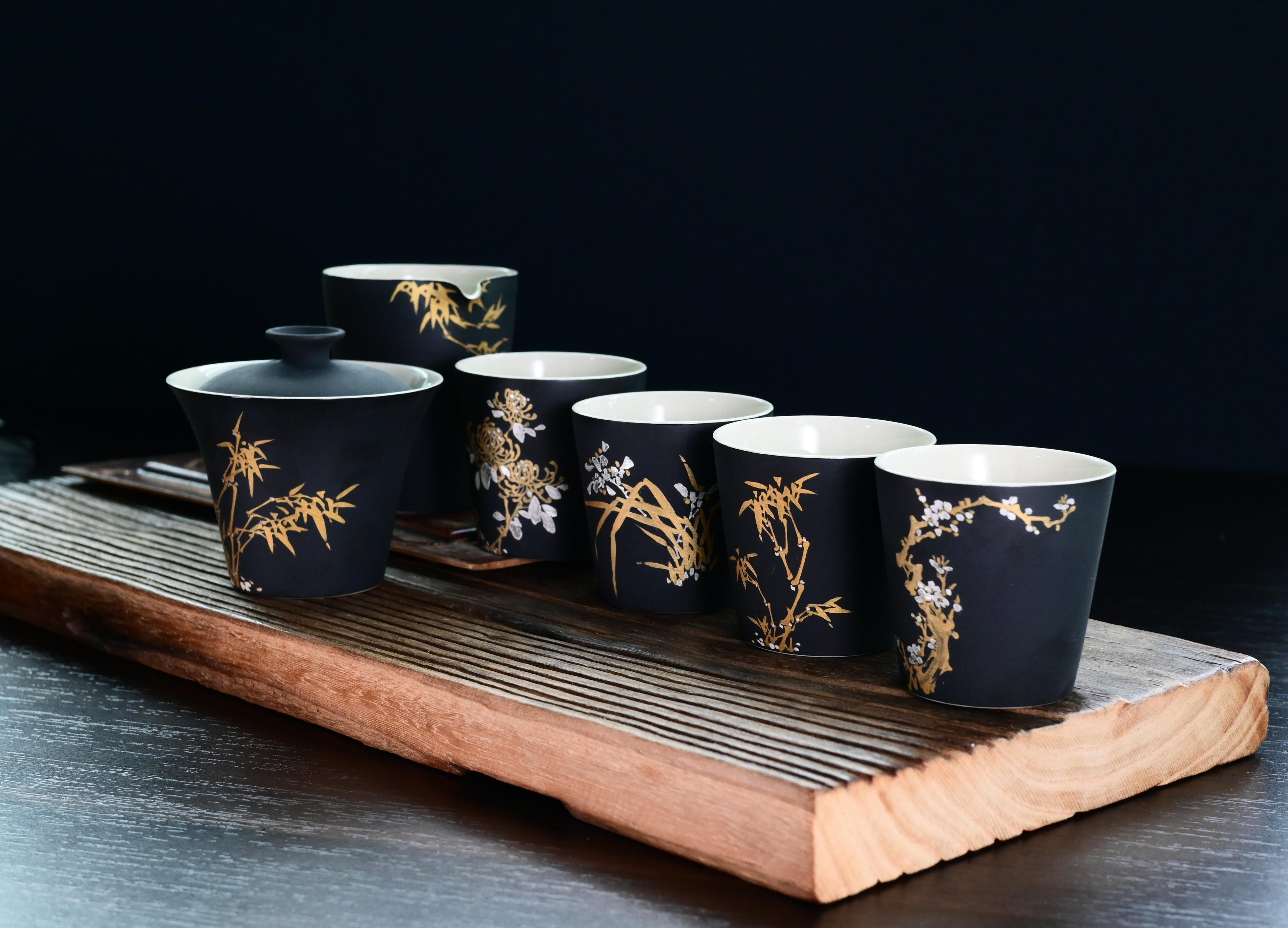 Four Gentlemen Matte Black Tea Cup – Handcrafted Ceramic with Nature Patterns