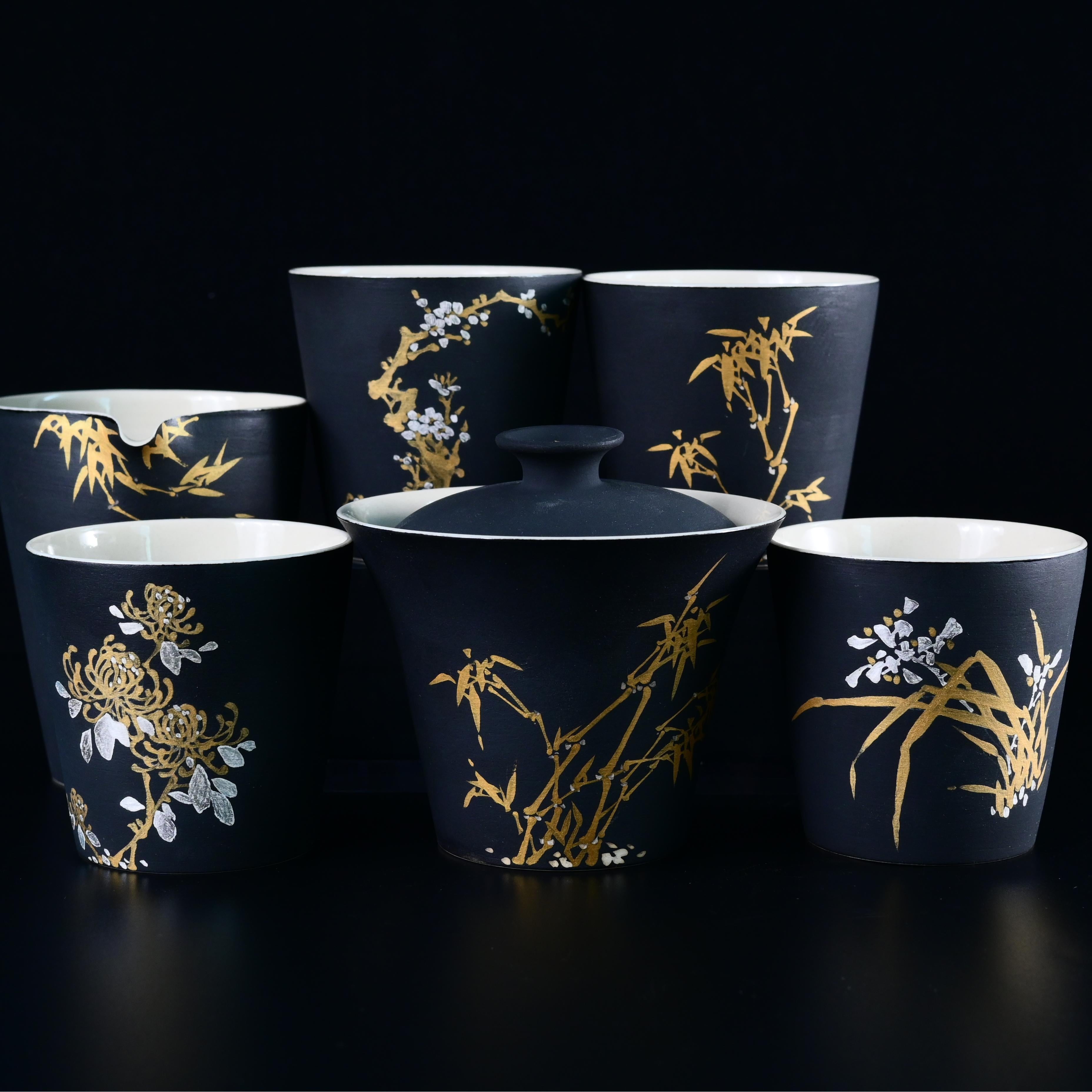 Four Gentlemen Matte Black Tea Cup – Handcrafted Ceramic with Nature Patterns