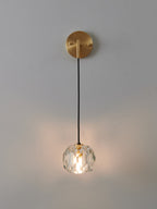 Multi-faceted clear crystal wall sconce