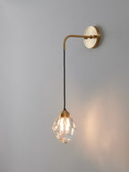 Multi-faceted clear crystal wall sconce
