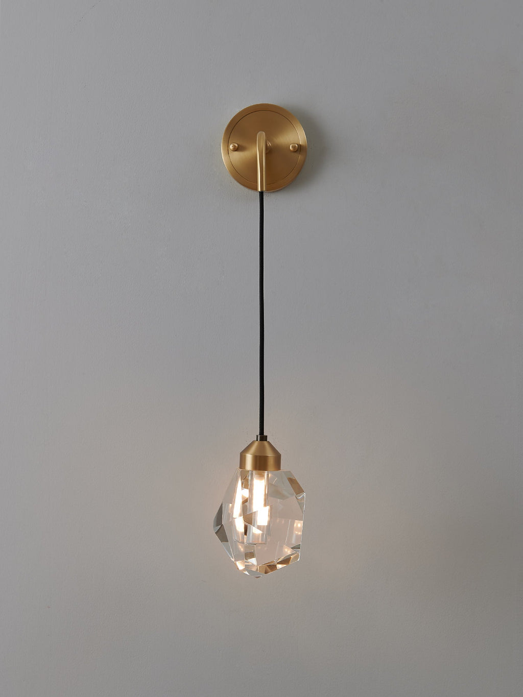 Multi-faceted clear crystal wall sconce