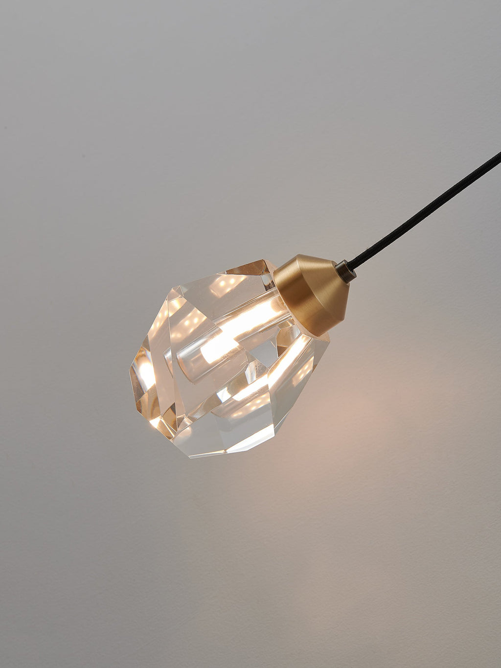 Multi-faceted clear crystal wall sconce